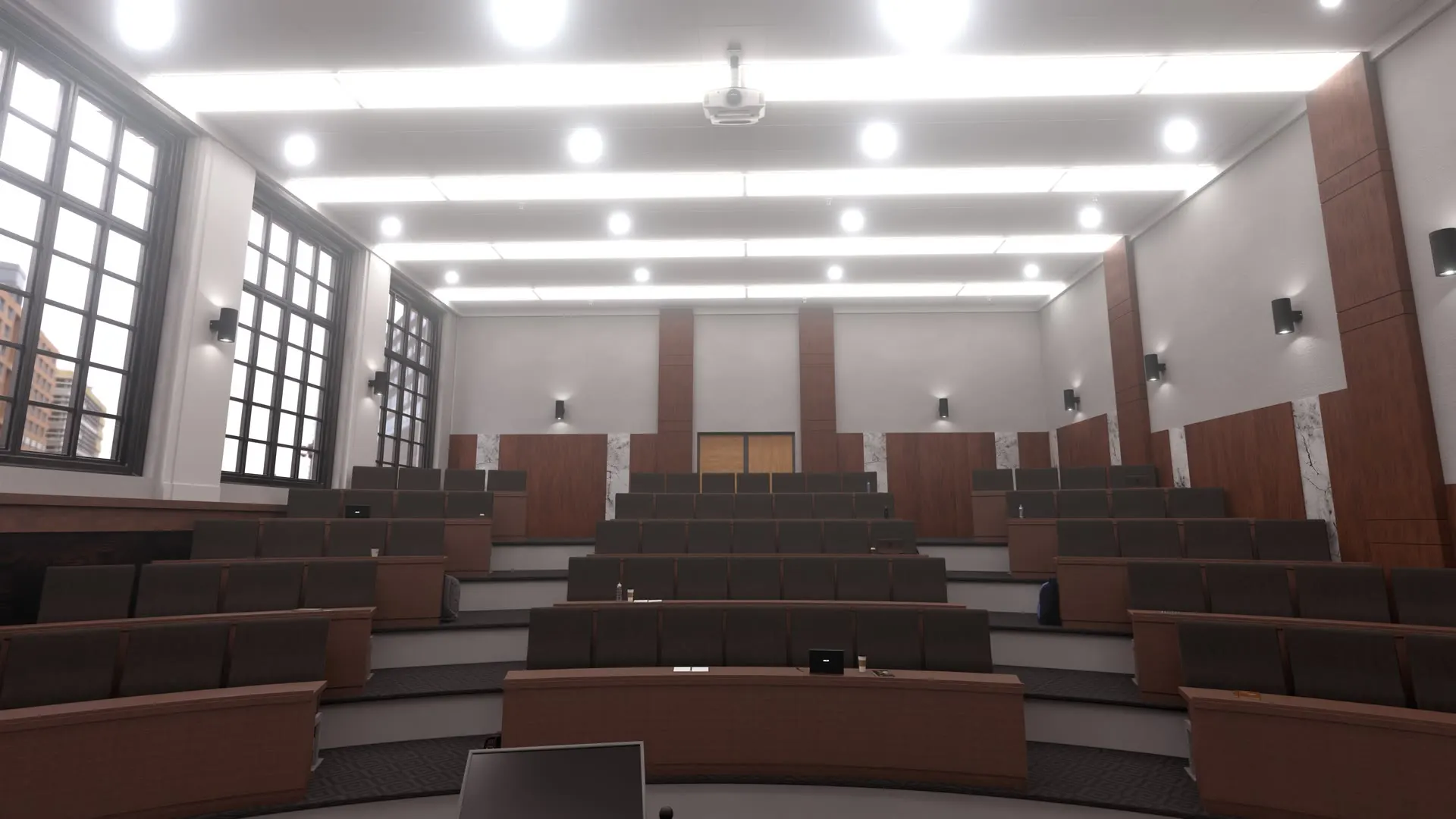 Tiered seating and tall windows along one wall.